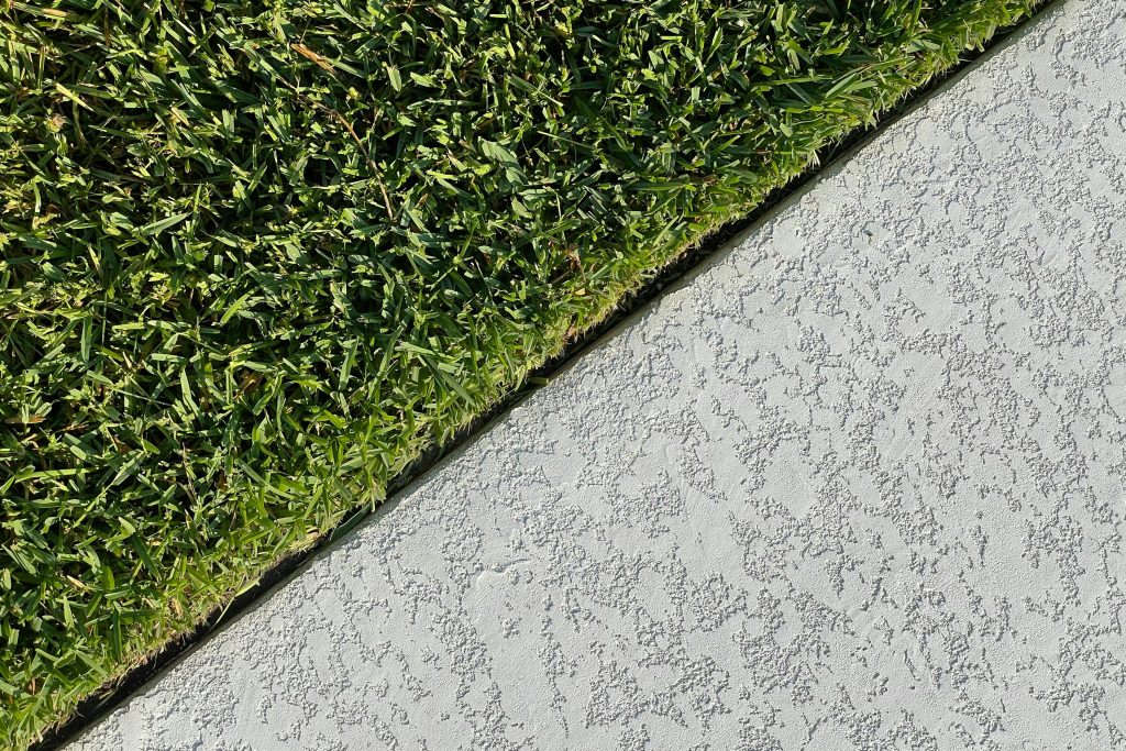 Perfect edging on a lawn beside a sidewalk