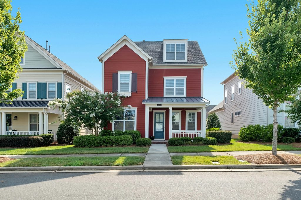 House with trimmed trees and hedges