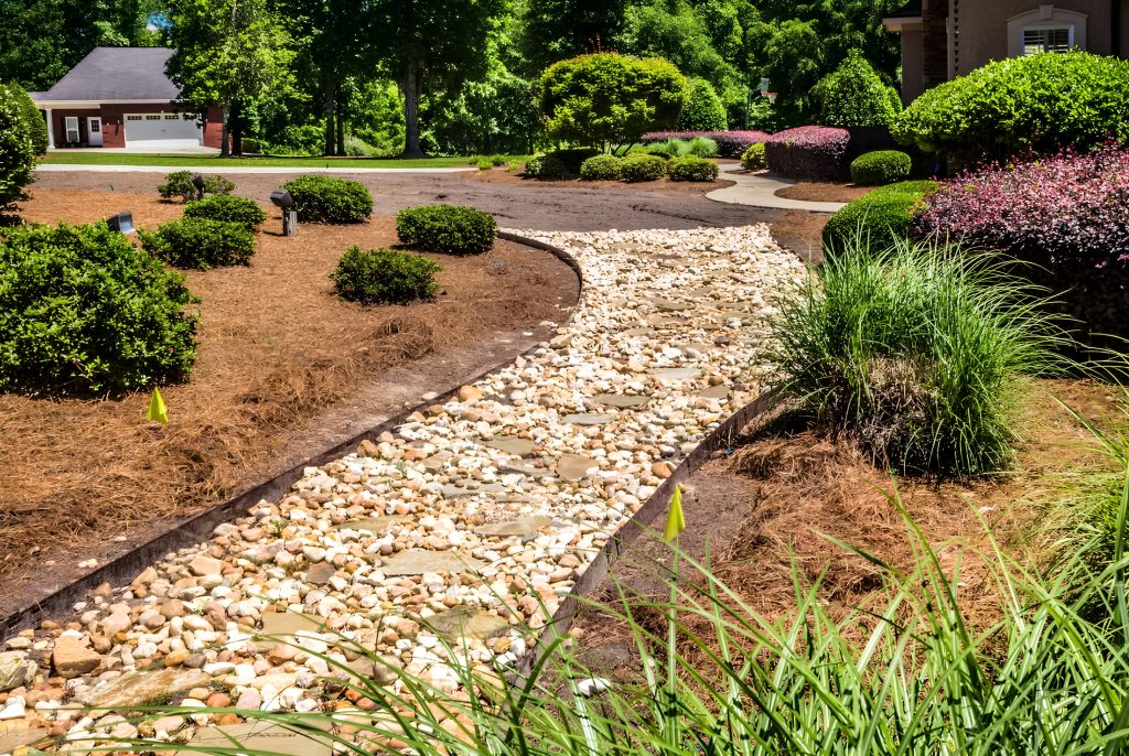 San Diego rock landscaping project, showing a rock pathway through a backyard.